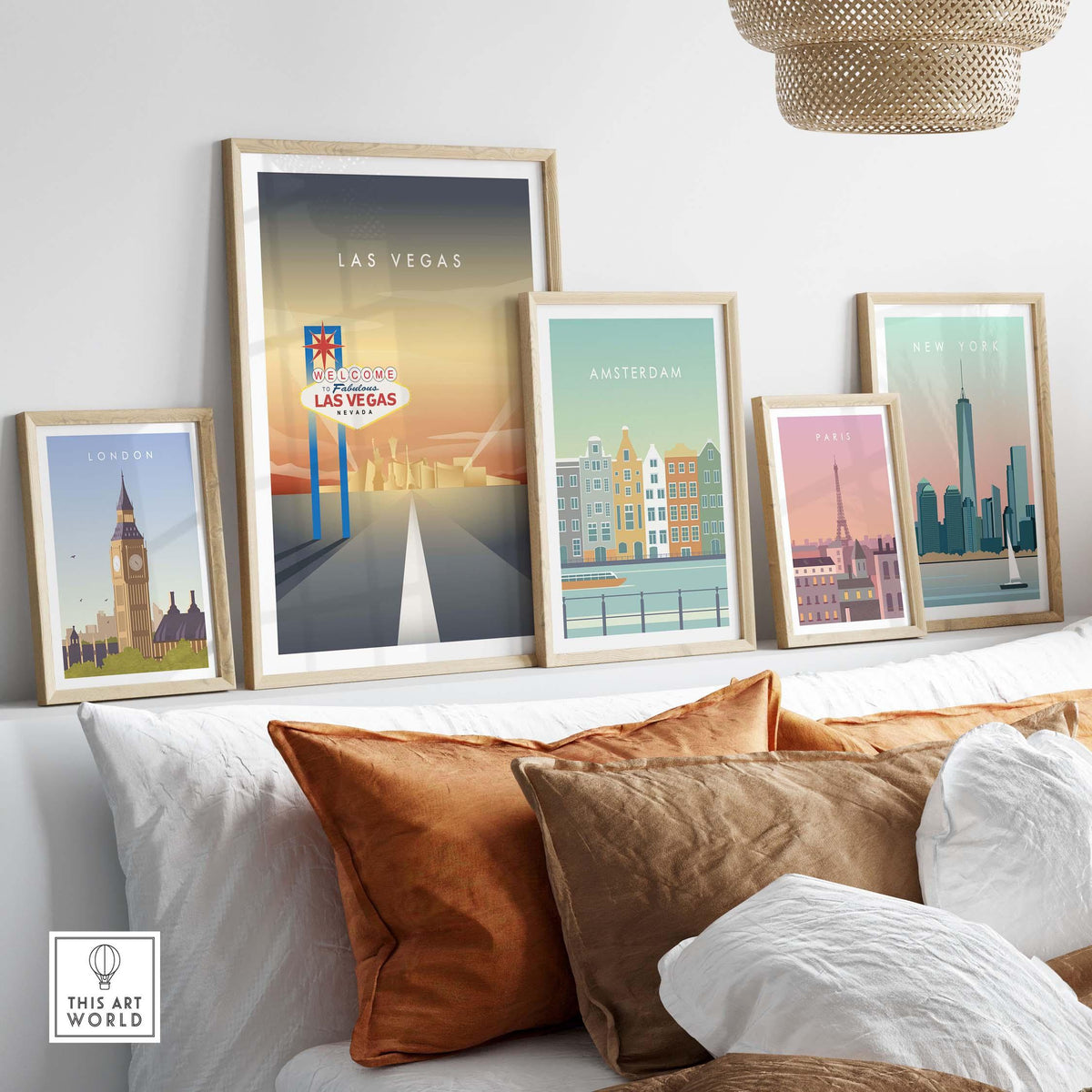 Stylish wall art display with Las Vegas, Amsterdam, London, Paris, and New York travel posters in framed settings.