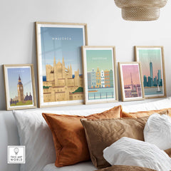 Mallorca Wall Art Poster among framed city posters on a stylish sofa, showcasing vintage travel inspiration.