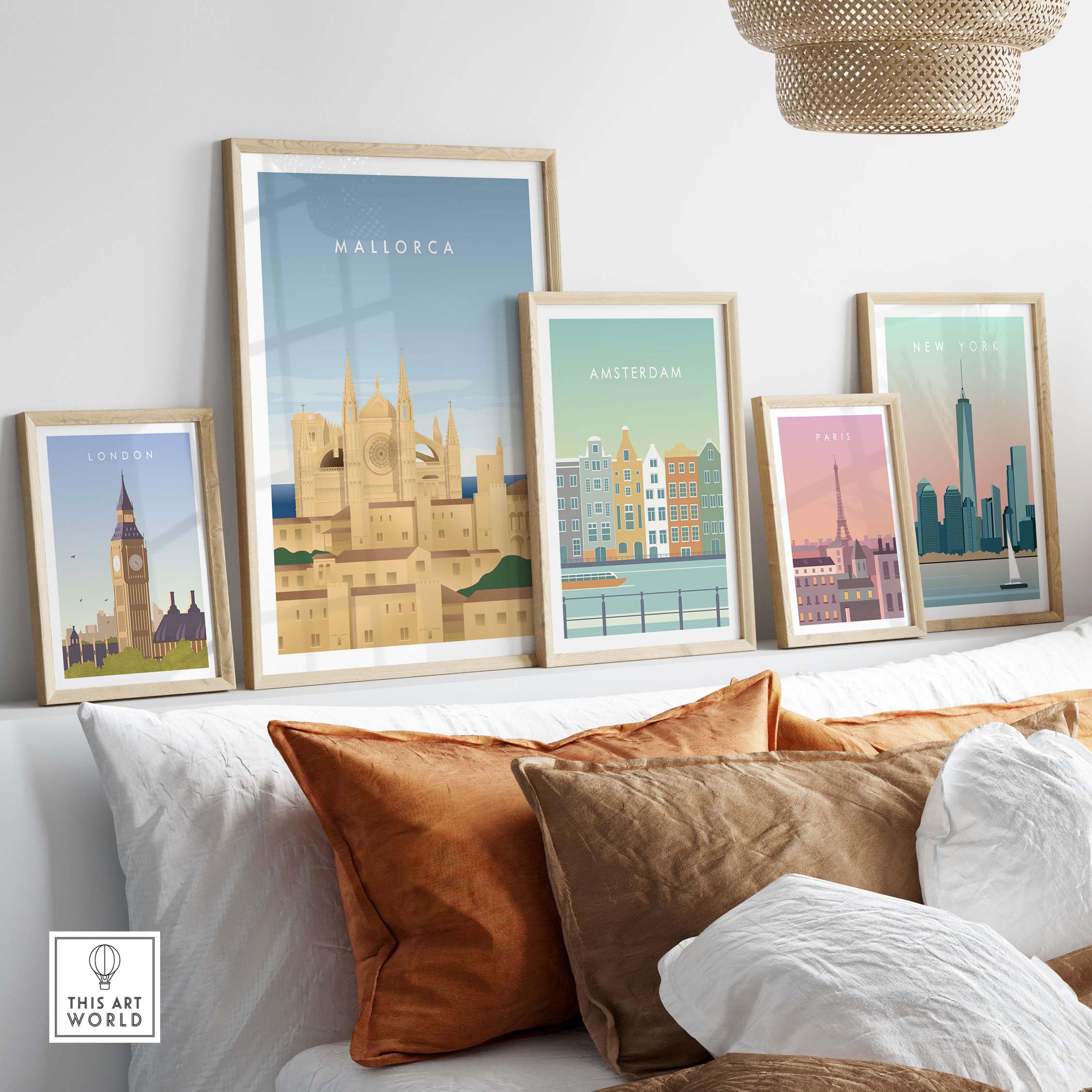 Mallorca Wall Art Poster among framed city posters on a stylish sofa, showcasing vintage travel inspiration.