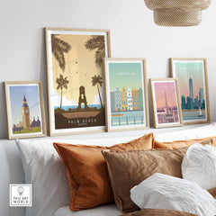 Palm Beach Florida Print among framed vintage travel posters in a stylish living room decor.