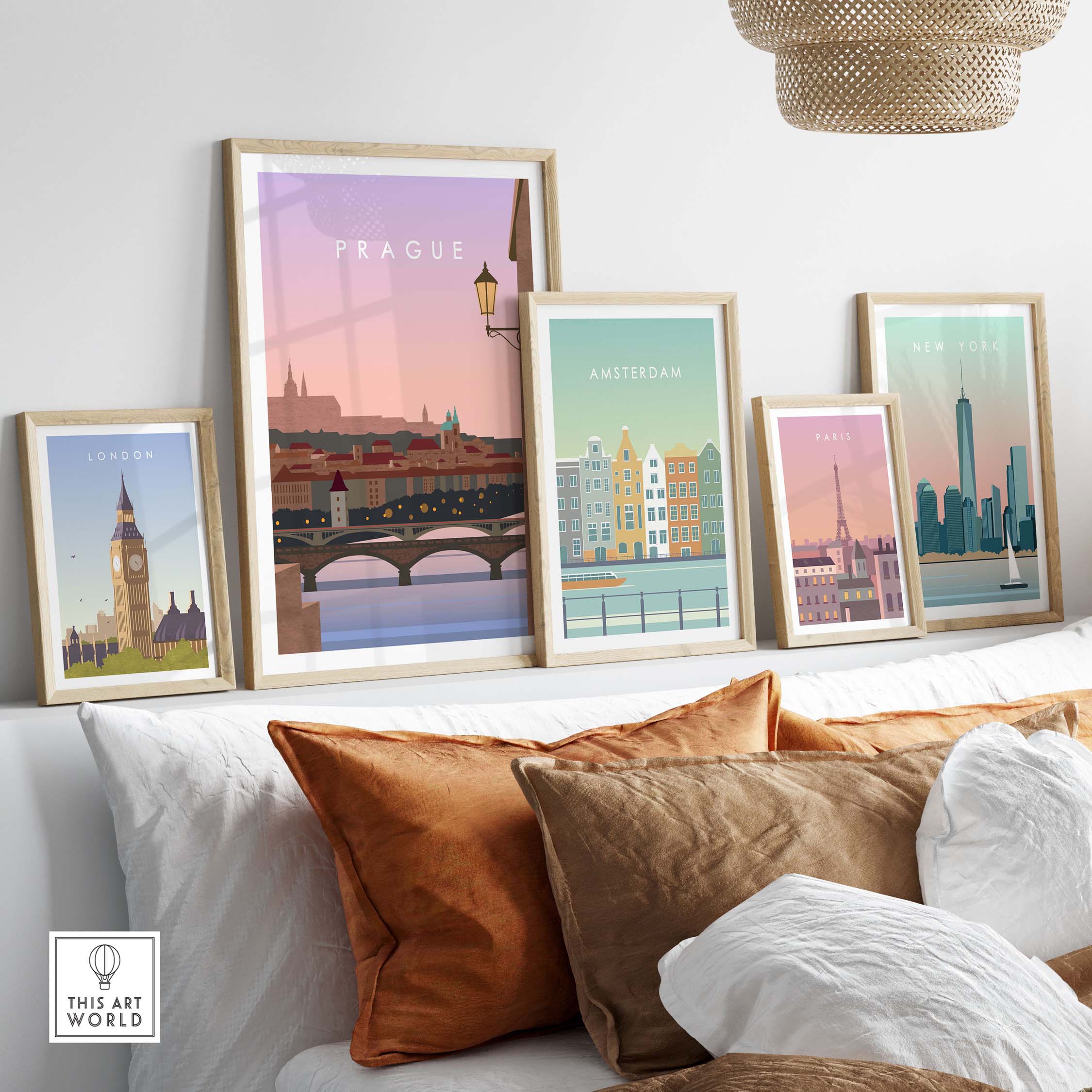 Framed travel wall art featuring iconic city prints of London, Amsterdam, New York, and Prague in a cozy living room setting.