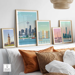 Seattle Print Wall Art Poster showcased among other city posters in a stylish home setting with decorative pillows.