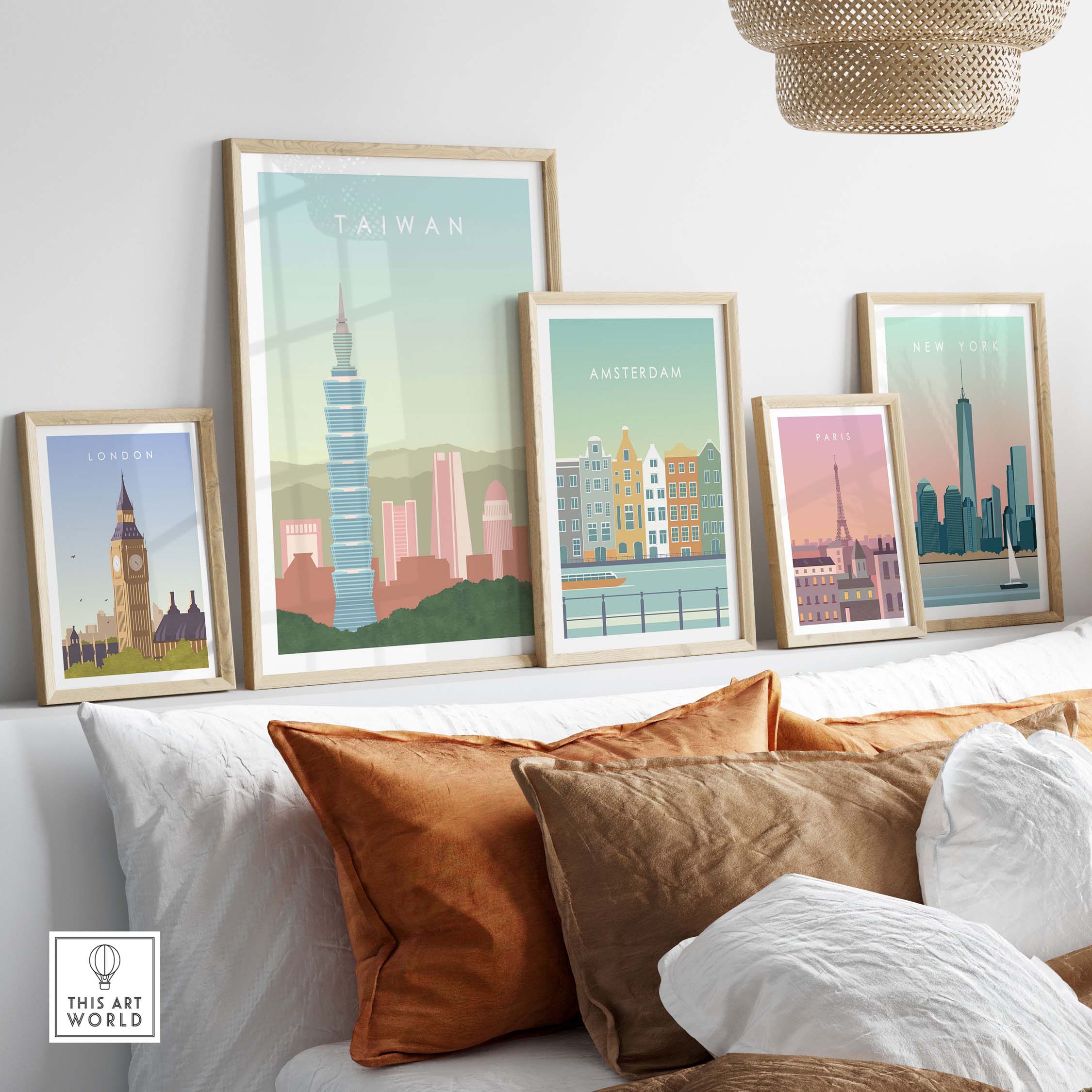 Framed Taiwan poster print along with other city artworks on a stylish sofa, showcasing travel-inspired wall art.