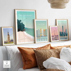Framed wall art prints featuring The Philippines, London, Amsterdam, Paris, and New York in a stylish living room setting.