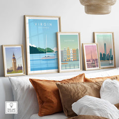Stylish Virgin Islands travel poster print among vintage city posters on a modern sofa with decorative pillows.
