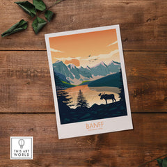 Banff National Park art print featuring mountains, a moose, and a sunset sky on rustic wooden background.