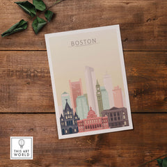 Boston Skyline Poster featuring iconic buildings in warm pastel tones on wooden surface.