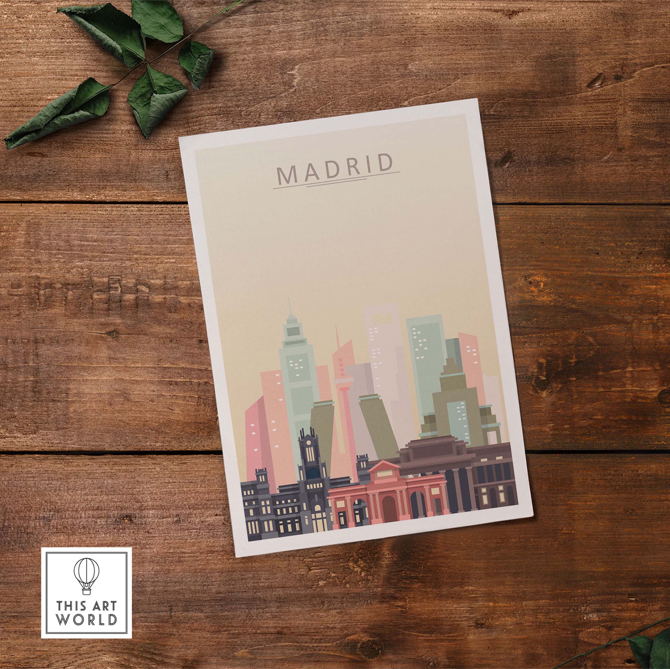 Madrid skyline print in warm pastel tones highlighting iconic architecture on a wooden background.