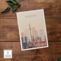 Munich skyline print in pastel colors on wood background, featuring iconic buildings and modern architecture.