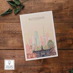 Rotterdam Skyline Print in pastel colors showcasing iconic architecture on a wooden background.