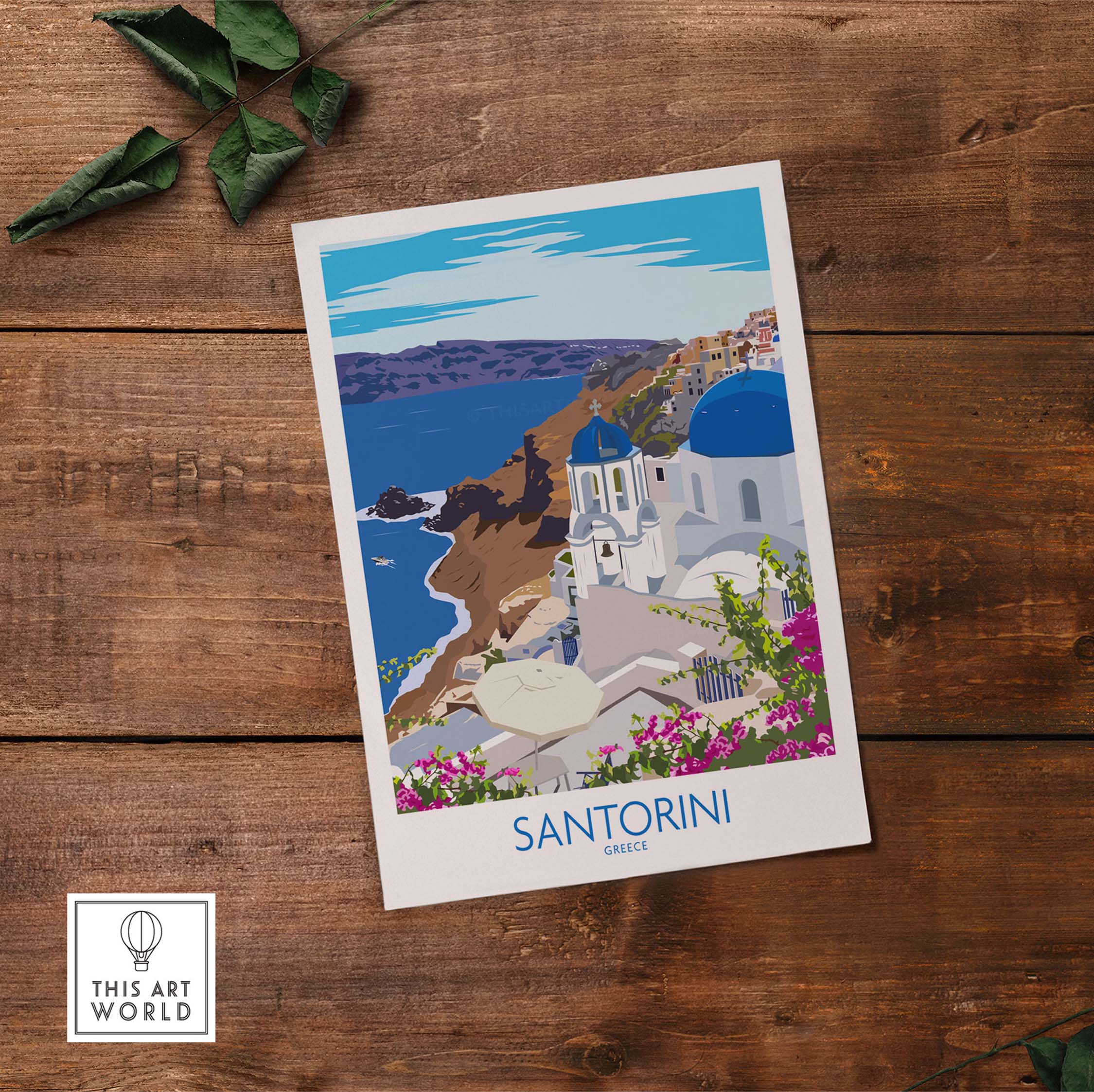 Santorini print travel poster showcasing the iconic blue-domed buildings and coastal views of Greece on a wooden background.
