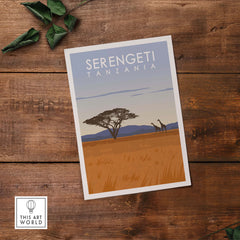 Serengeti Print Tanzania travel poster featuring a giraffe and acacia tree on a sunset background.