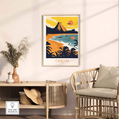 Cancun travel poster print featuring a sunset over a tropical beach with ancient ruins, displayed in a stylish living room.