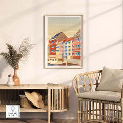 Copenhagen wall art poster showcasing colorful buildings, framed and styled in a modern living room setting.