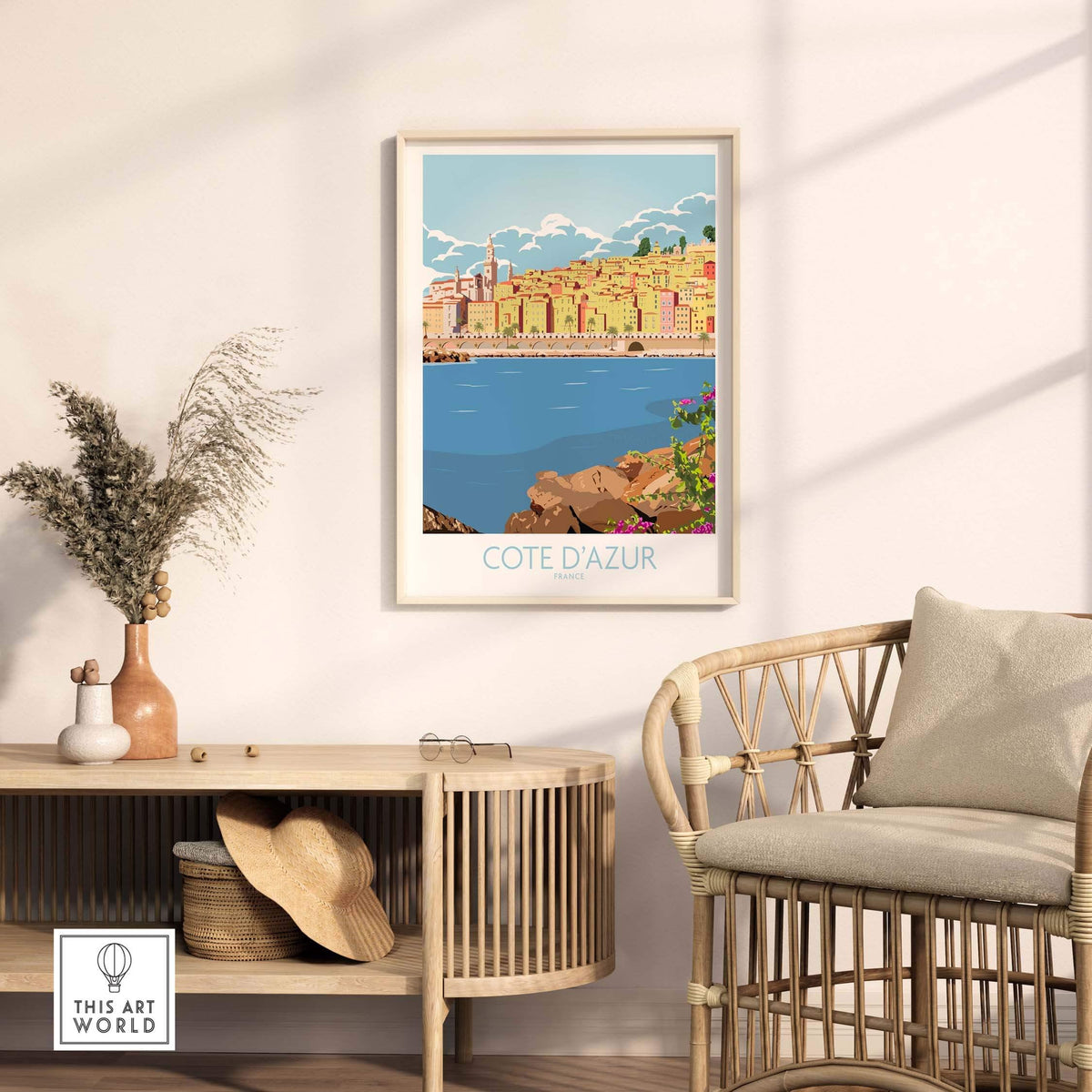 Cote d'Azur print poster in a stylish living room setting, framed artwork showcasing coastal scenery.