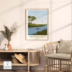 Okavango Delta vintage travel poster framed in a stylish living room with rattan chair and natural decor