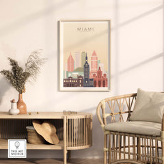 Miami skyline wall art print in pastel colors displayed in a modern living space with a stylish rattan chair.