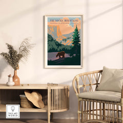 Rocky Mountains Canada vintage print featuring a bear in a forest, perfect for home or office decor.