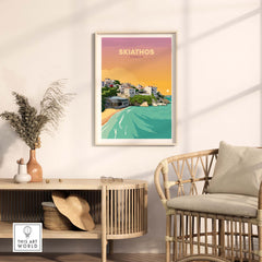 Skiathos travel poster print featuring a coastal scene in Greece, framed and displayed in a stylish interior setting.