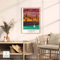 Valletta Print Malta Poster displayed in a stylish living room with rattan furniture and a coastal view.